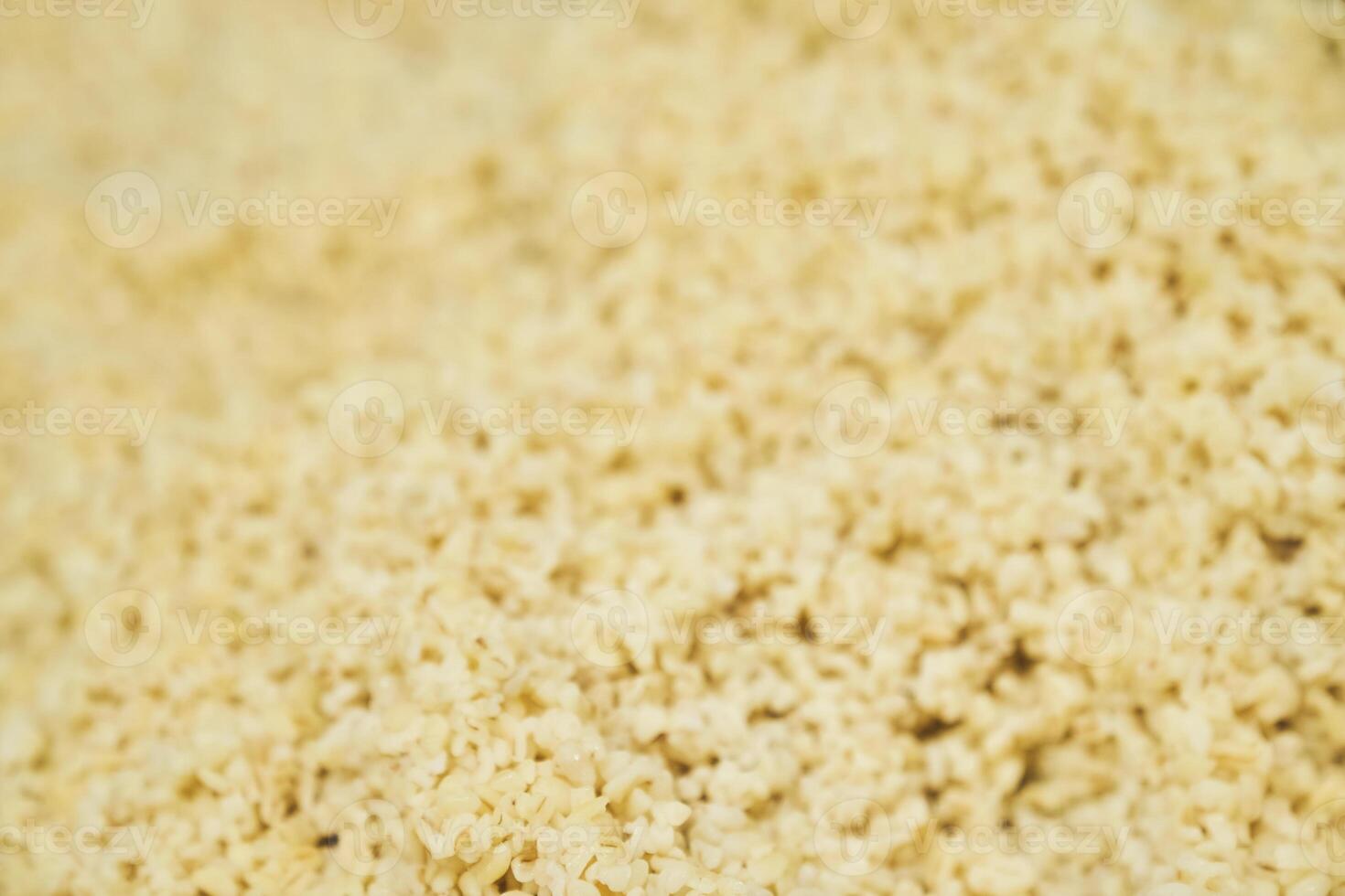 Selective focus on the side dish. Boiled bulungur in close-up. Healthy food with the ability to copy photo