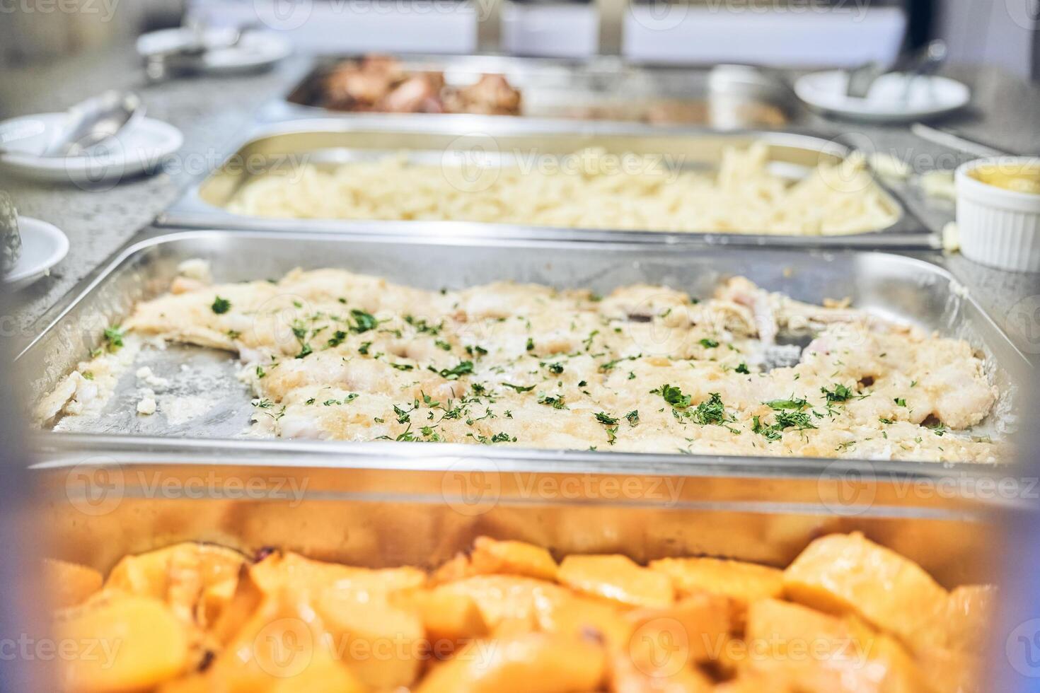 Close-up of a metal container with baked food. To give free food to starving people. With space to copy photo