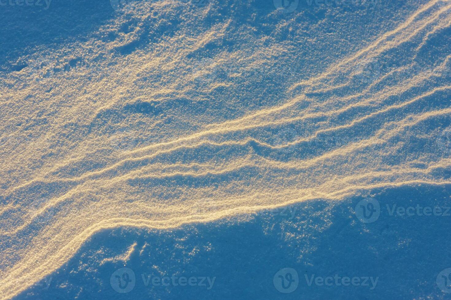 snow texture on the lake on a sunny day Selective focus photo