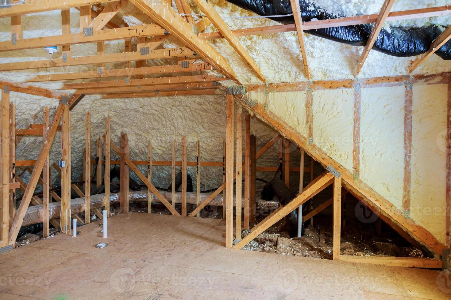 Inside wall heat isolation with mineral wool in wooden house, building under construction photo
