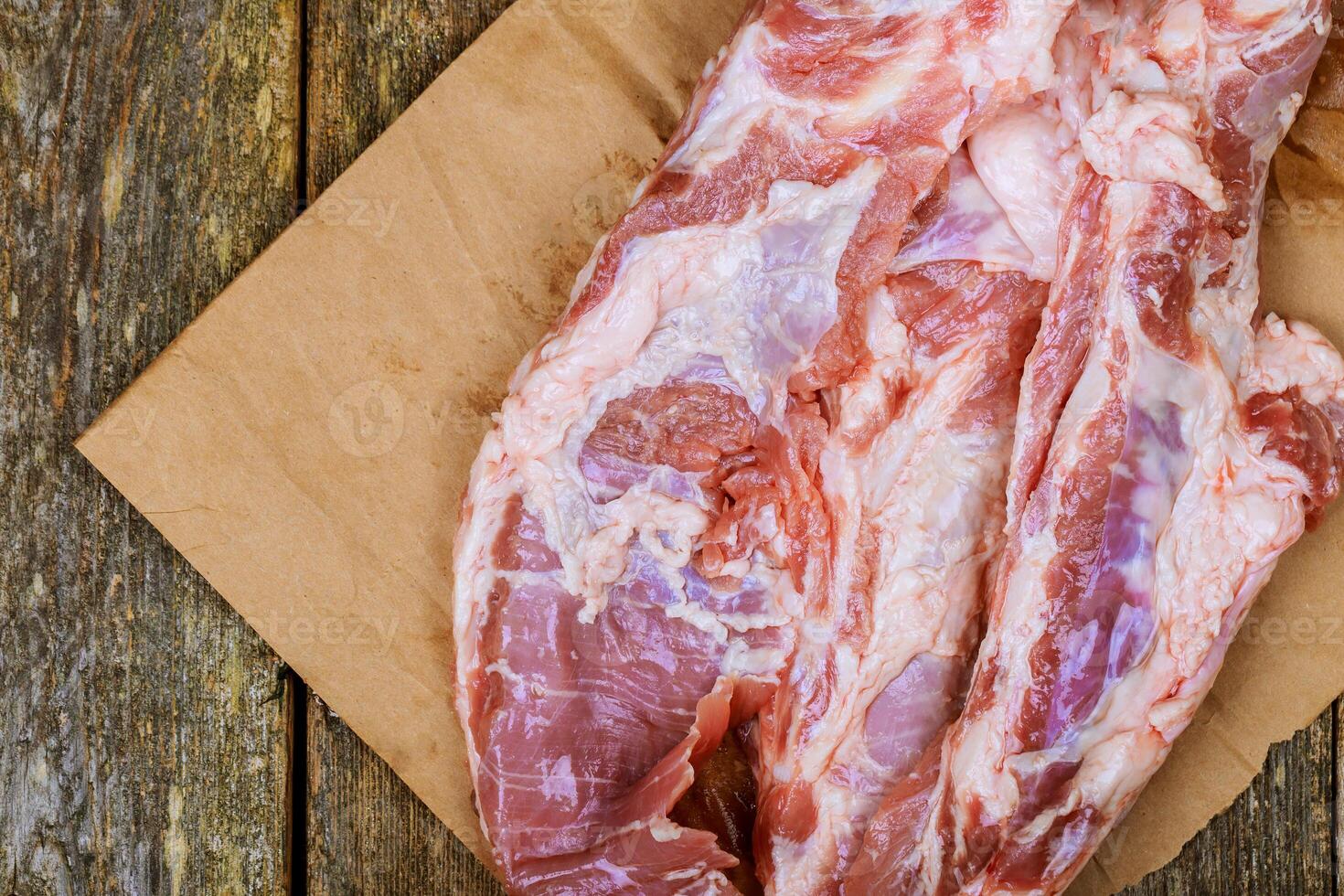 Fresh uncooked raw sliced meat Raw pork on cutting board photo