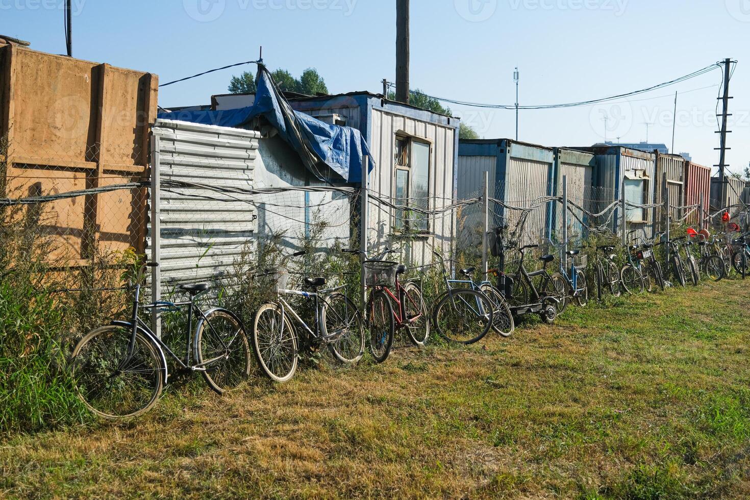 Containers for construction workers with bicycles next to them photo