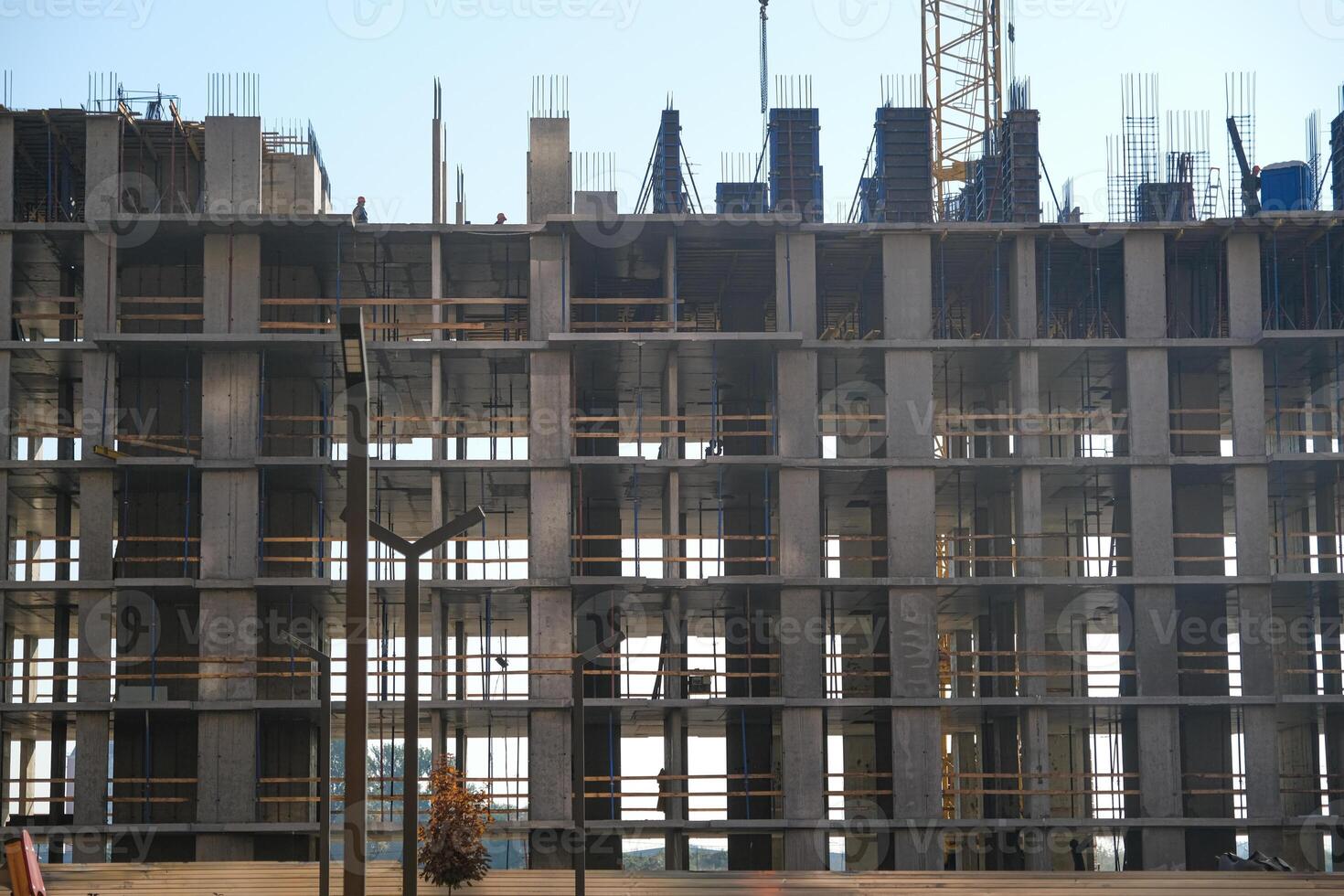 the foundation of a multi-storey building through which the sun's rays penetrate photo