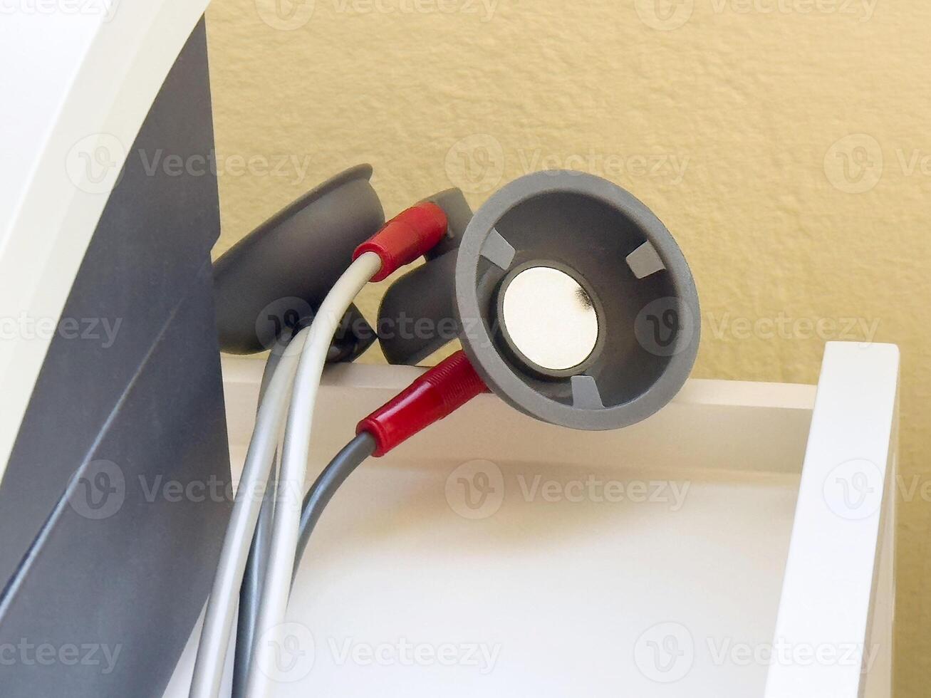 Cardiology equipment with multiple stethoscope heads in medical setting photo
