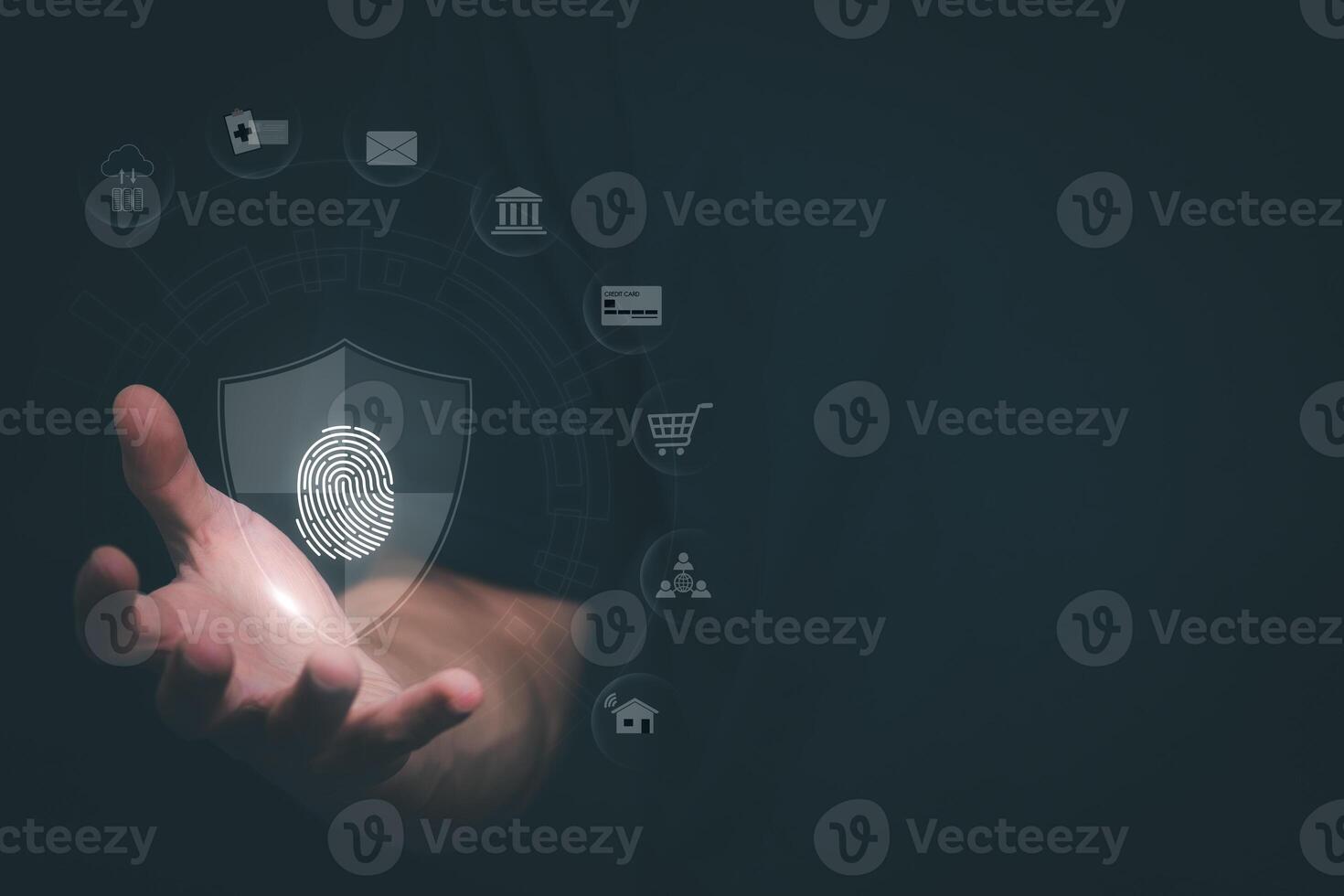 a person holding a fingerprint on a screen with icons of security and data security photo