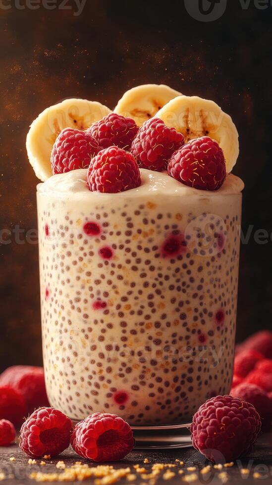 Creamy chia seed pudding topped with fresh raspberries and banana slices in a cozy setting photo