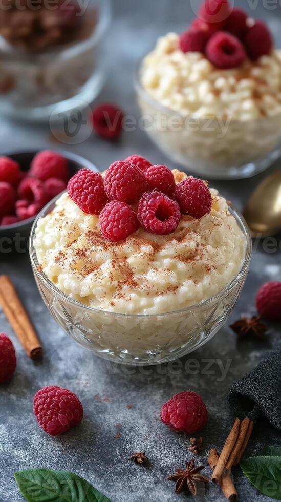 Delicious rice pudding topped with fresh raspberries and cinnamon at a cozy kitchen setting photo