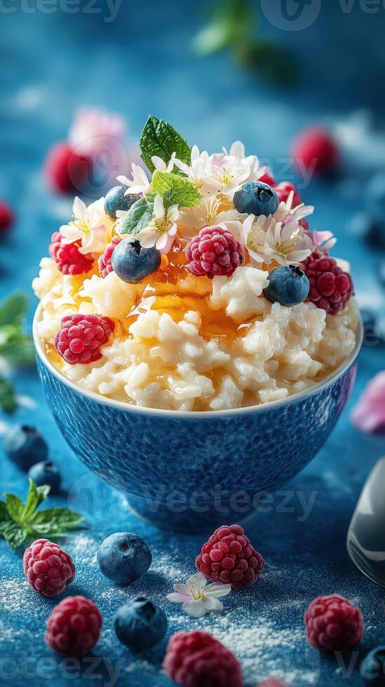 Delicious dessert bowl with rice pudding topped with fresh berries and edible flowers in a vibrant setting photo