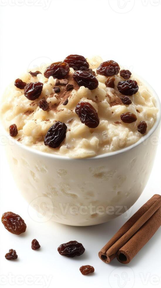 Creamy rice pudding topped with raisins and sprinkled with cinnamon photo