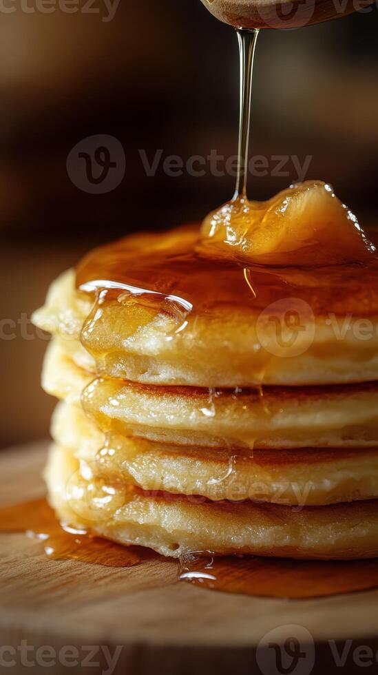 Stack of fluffy pancakes drizzled with warm syrup, ready to enjoy for breakfast or dessert photo