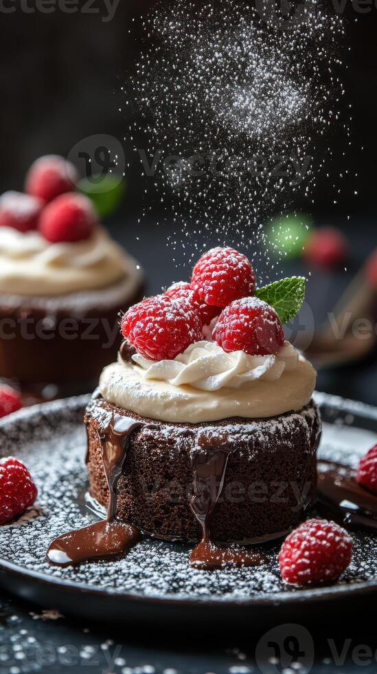Decadent chocolate dessert with fresh raspberries and whipped cream on a dark plate photo