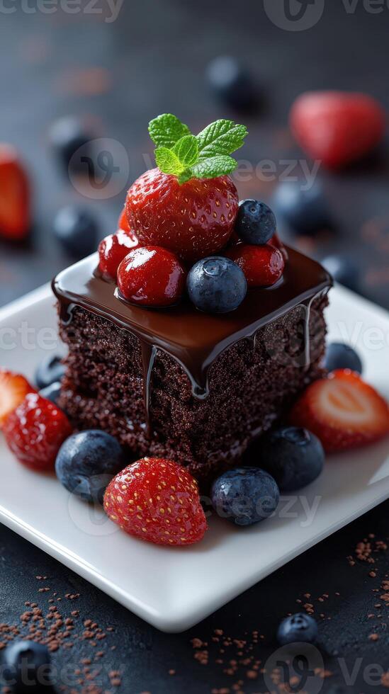 Delicious chocolate cake topped with fresh berries served on a white plate in a vibrant setting photo