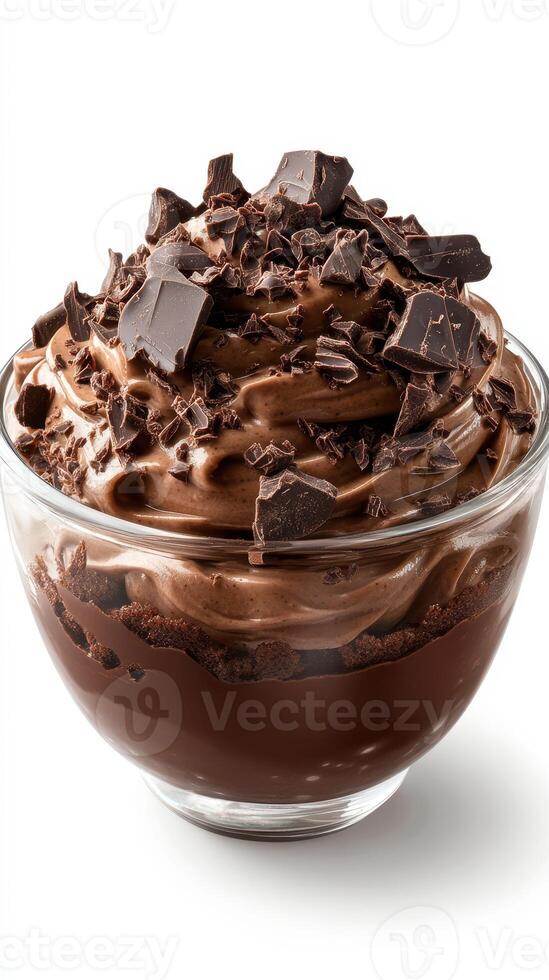 Decadent chocolate dessert in a glass bowl topped with chocolate shavings and chunks photo