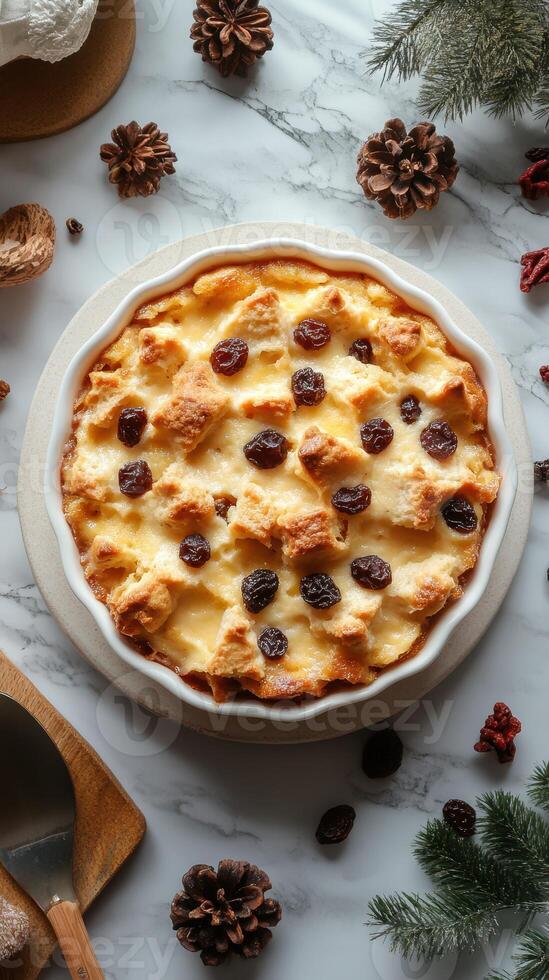Delicious bread pudding with raisins and spices on a marble countertop surrounded by pine cones and natural elements photo