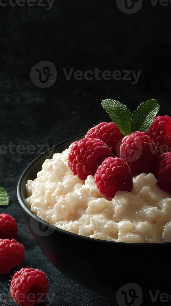 Fresh raspberries on creamy cottage cheese in a dark setting showcasing a delicious dessert selection photo