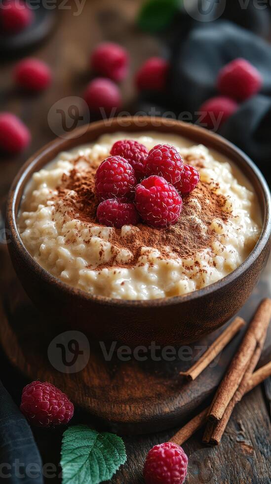 Delicious bowl of creamy oatmeal topped with fresh raspberries and cinnamon in a cozy kitchen setting photo