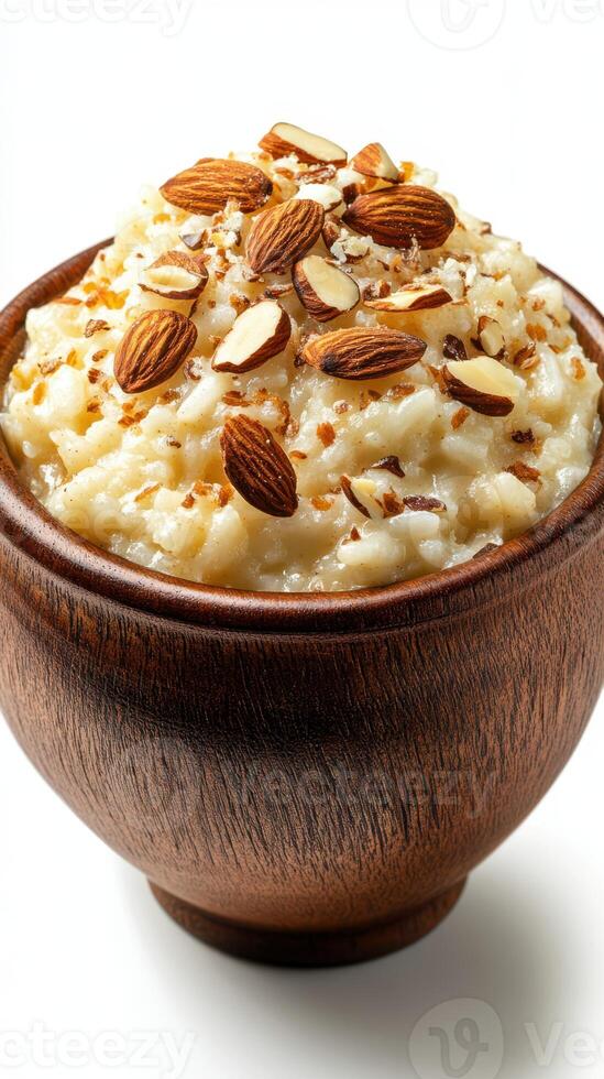 Creamy dessert with almonds served in a wooden bowl, perfect for any occasion or celebration photo