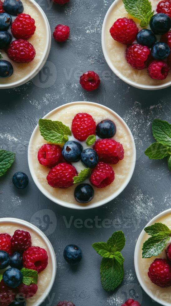 Delicious dessert bowls with fresh berries and mint arranged on a textured surface photo