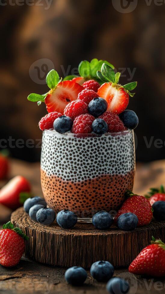 Delicious chia seed pudding topped with fresh berries on a rustic wooden table photo