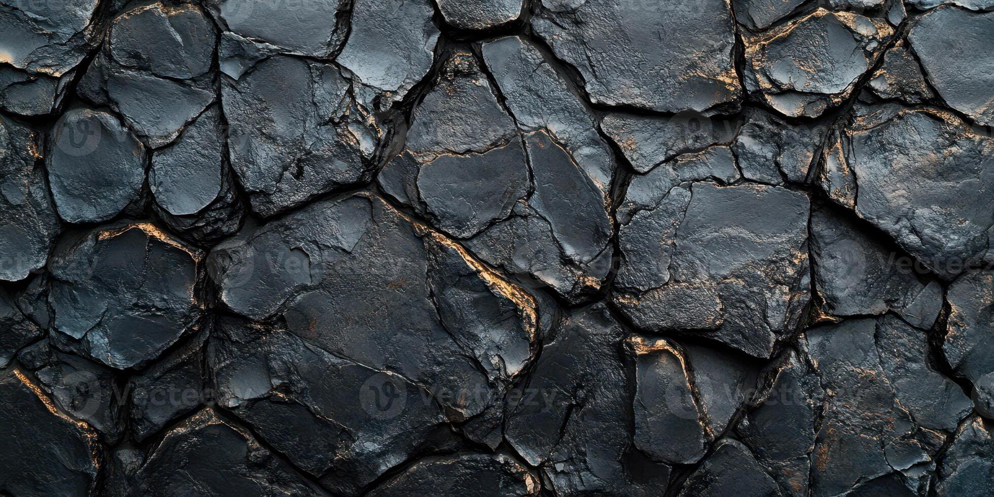 Dark textured surface showcasing cracked and fractured stone patterns under natural light in a close-up view photo
