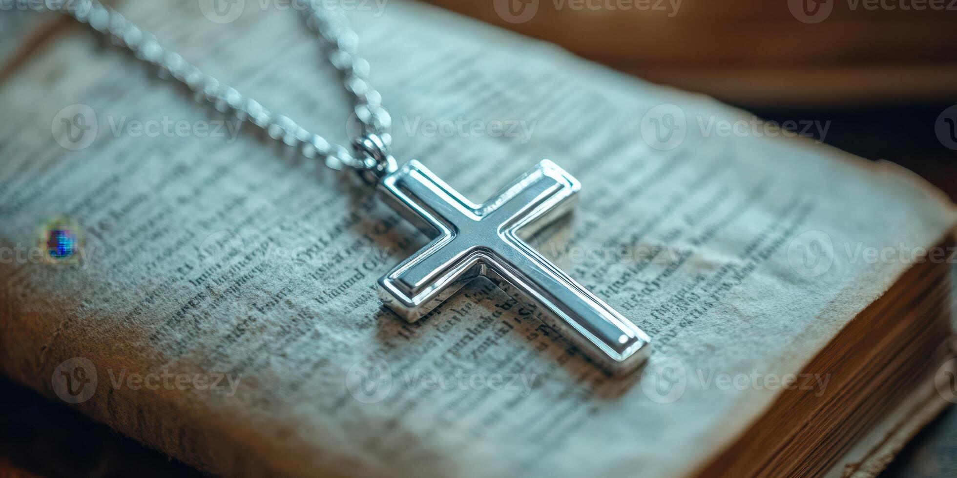 Elegant silver cross resting on an antique book with detailed pages in soft lighting setting ambiance photo