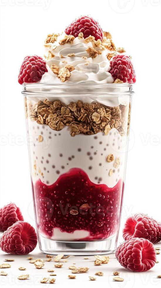 Delicious layered dessert with raspberries, yogurt, and granola in a clear glass container photo