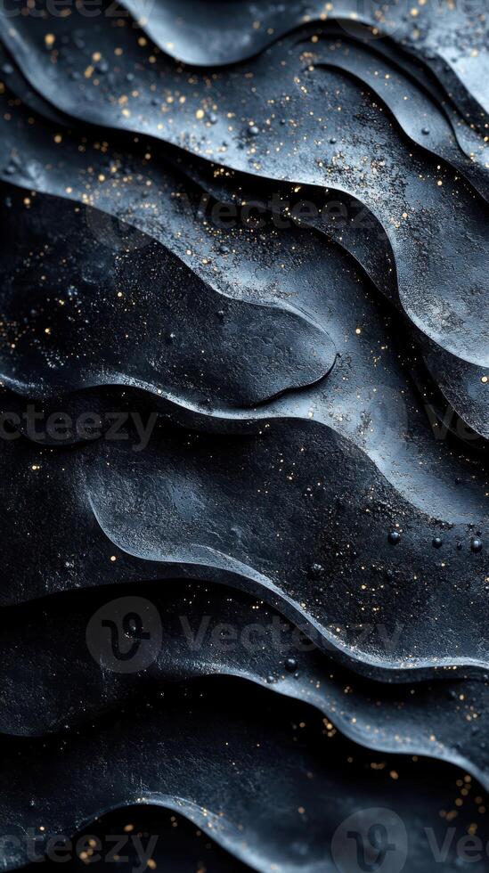 Textured black surface with golden specks highlights intricate patterns and depth under soft lighting photo
