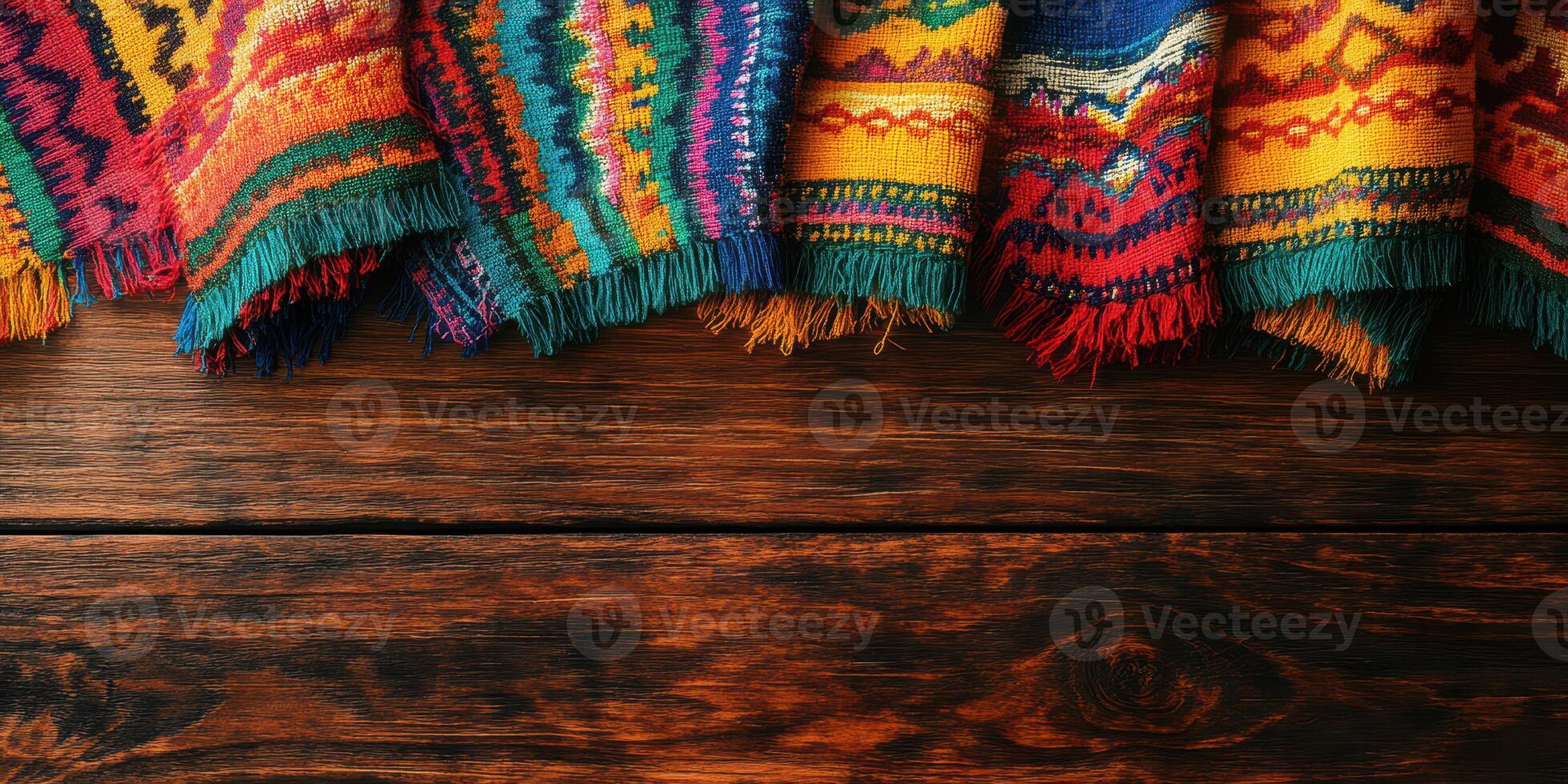 Colorful woven textiles displayed on a rustic wooden table showcasing vibrant patterns and traditional craftsmanship photo