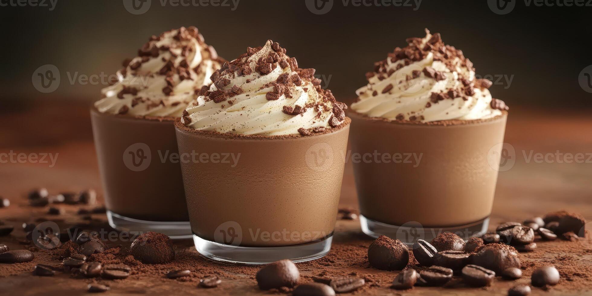Delicious chocolate desserts topped with whipped cream and cocoa served in elegant glasses on a rustic wooden table photo
