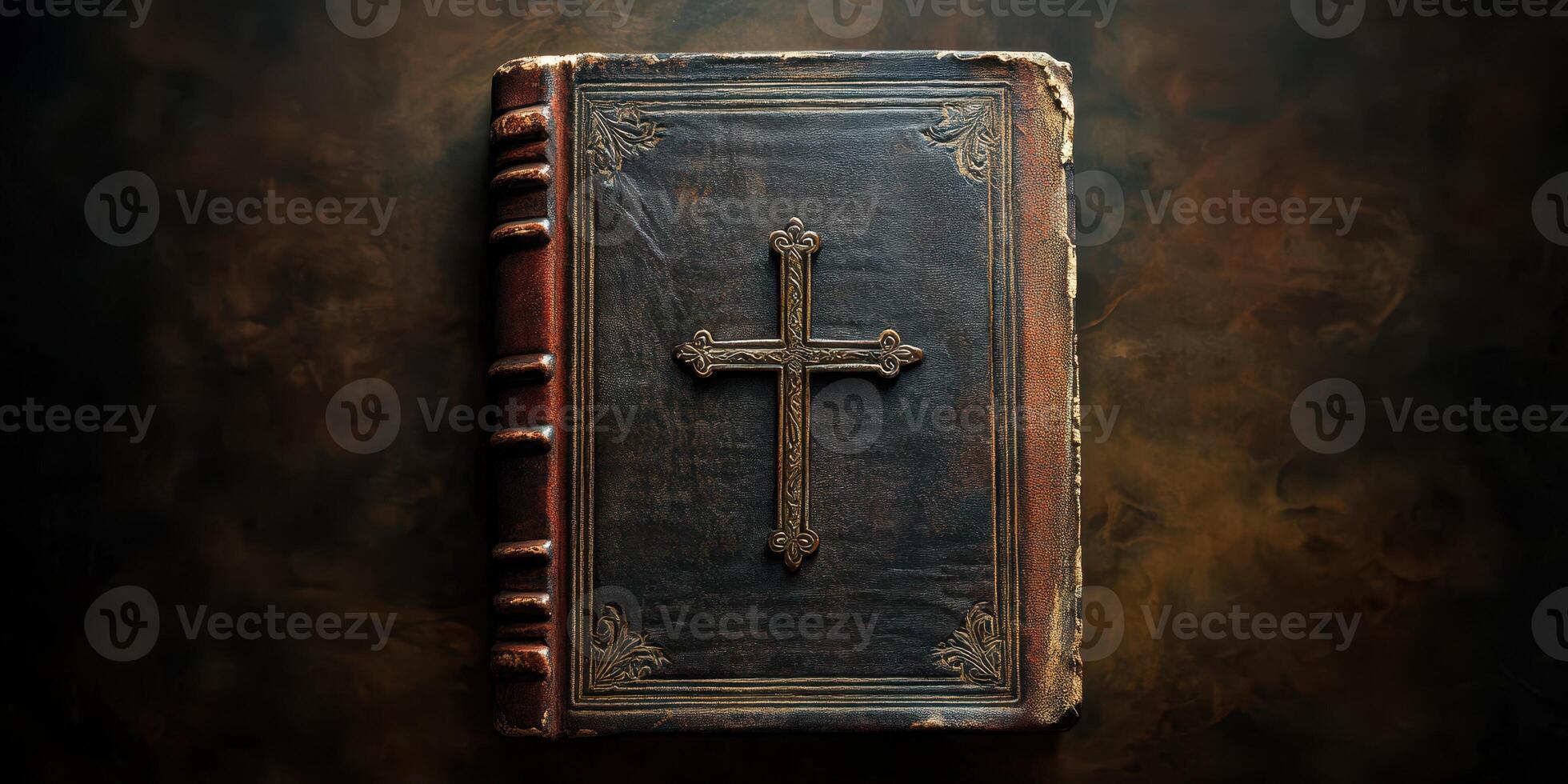Beautifully crafted leather-bound book featuring an embossed cross on the cover resting on a dark textured surface photo