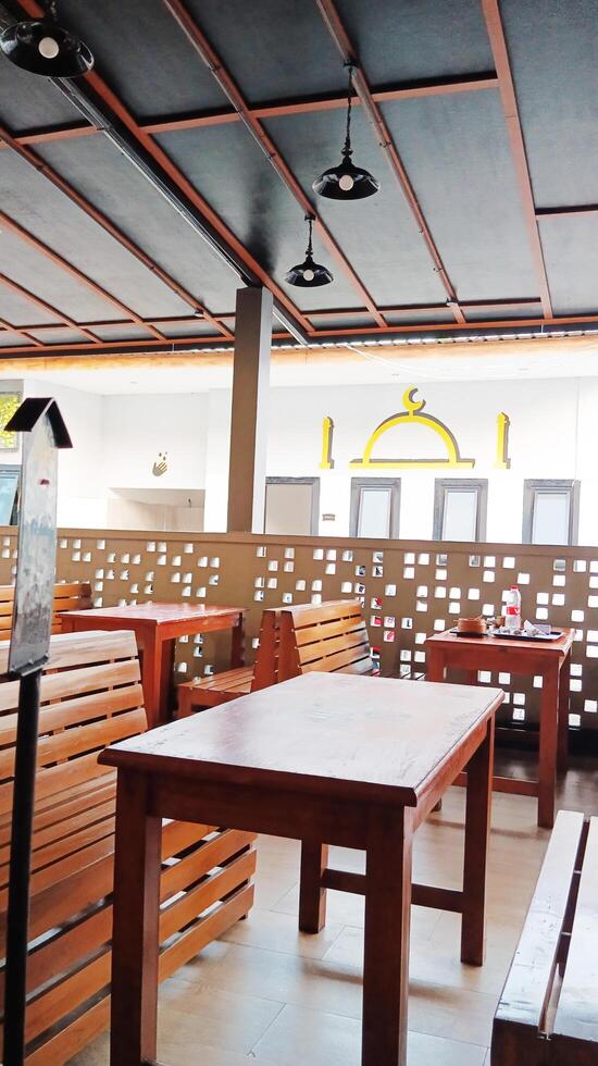 Wooden chairs and tables in the cafe. photo