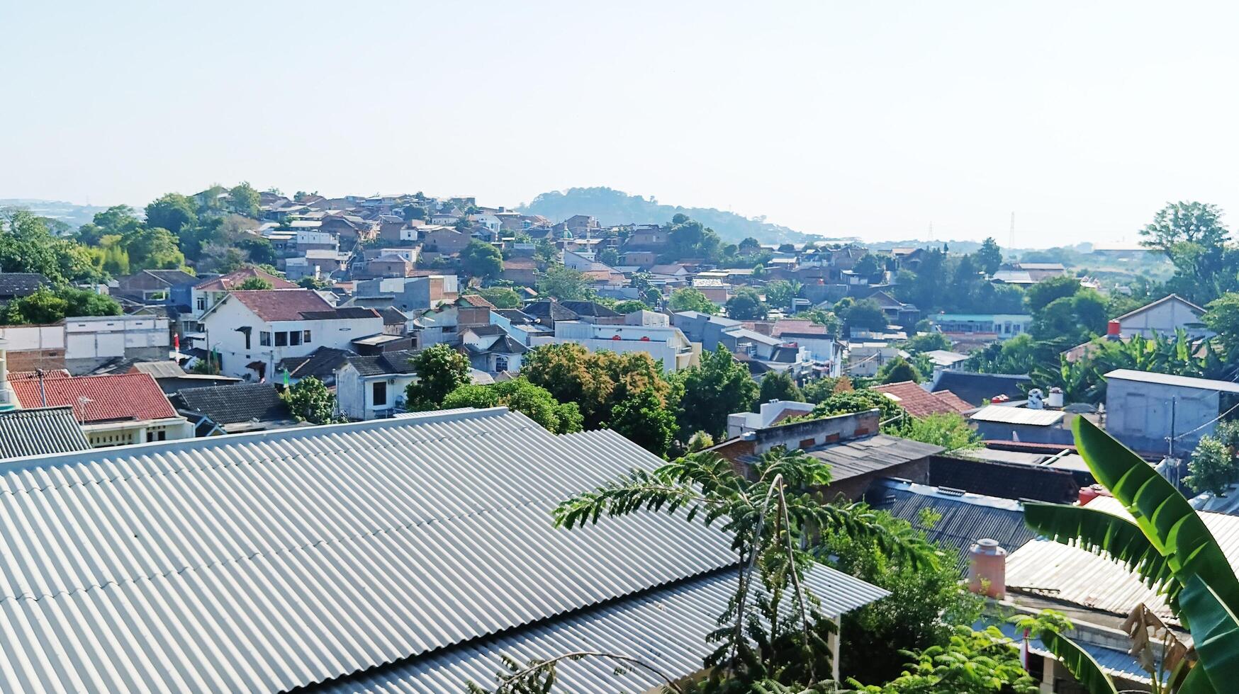 View of densely populated houses from the top of the hill. photo