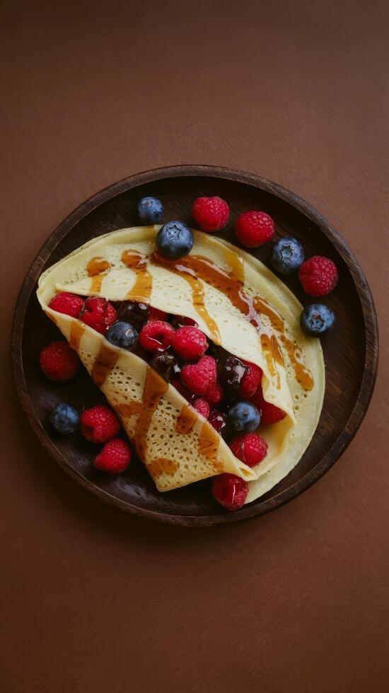 A plate with a pancake and berries on it photo
