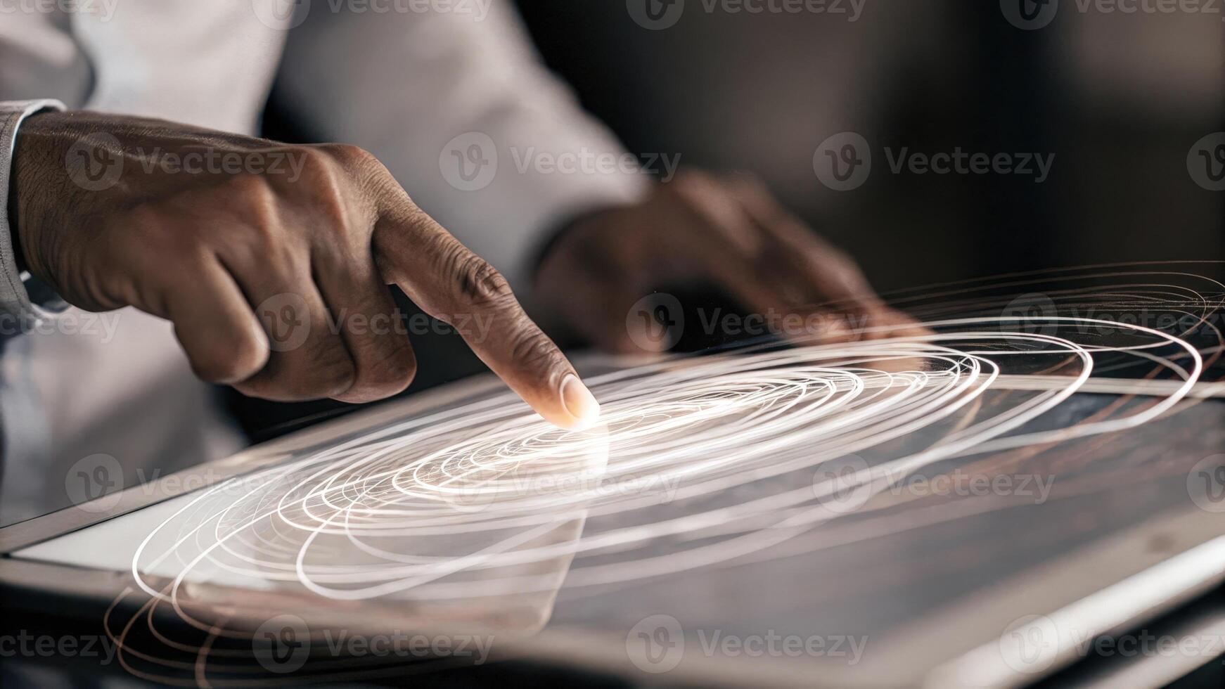 A closeup of the hands of a consultant manipulating holographic projections of business models with swirling data points responding to their touch in realtime.. photo