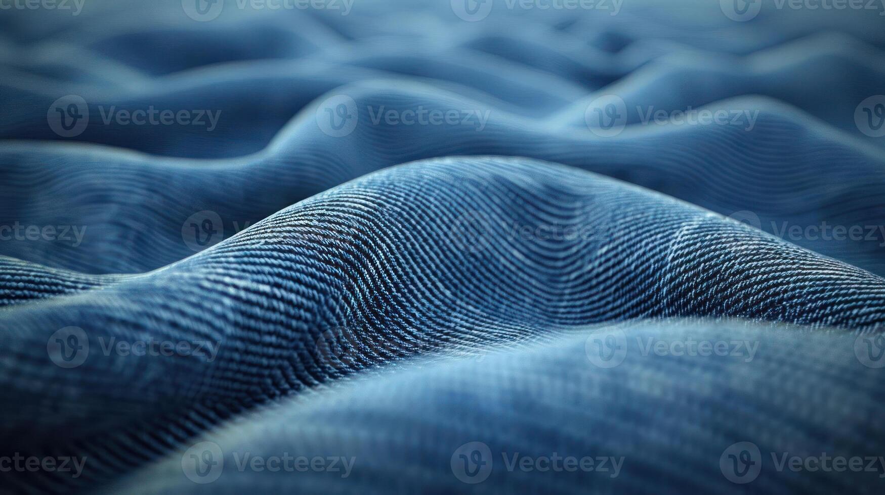 A close-up view of textured blue fabric, showcasing waves and folds. photo
