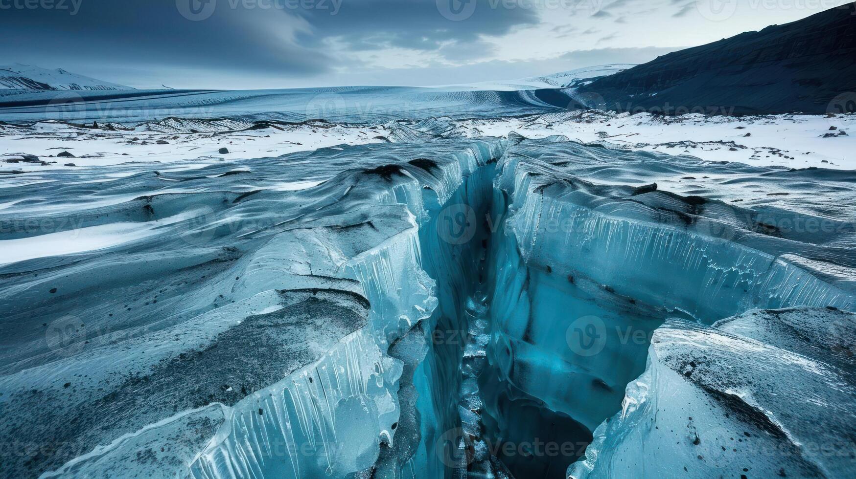 A stunning glacial crevice reveals layers of ice and blue hues in a remote landscape. photo