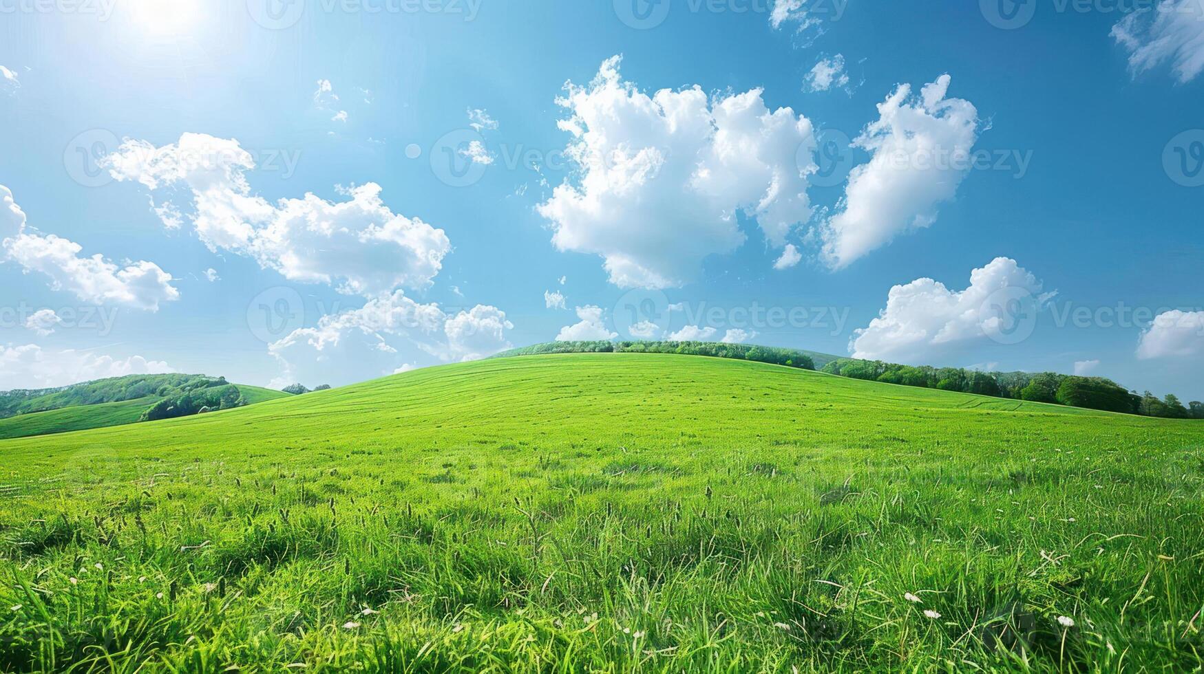 A vibrant green hillside under a bright blue sky with fluffy white clouds. photo