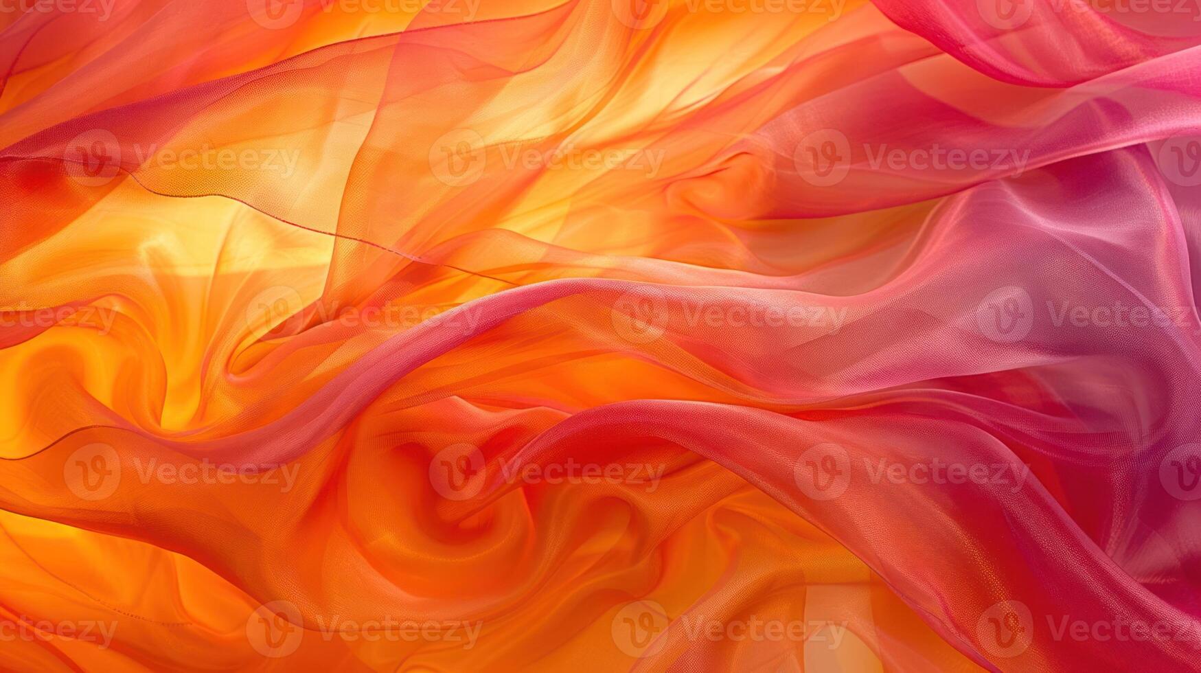 Vibrant flowing fabric in shades of orange and pink, creating a dynamic visual effect. photo