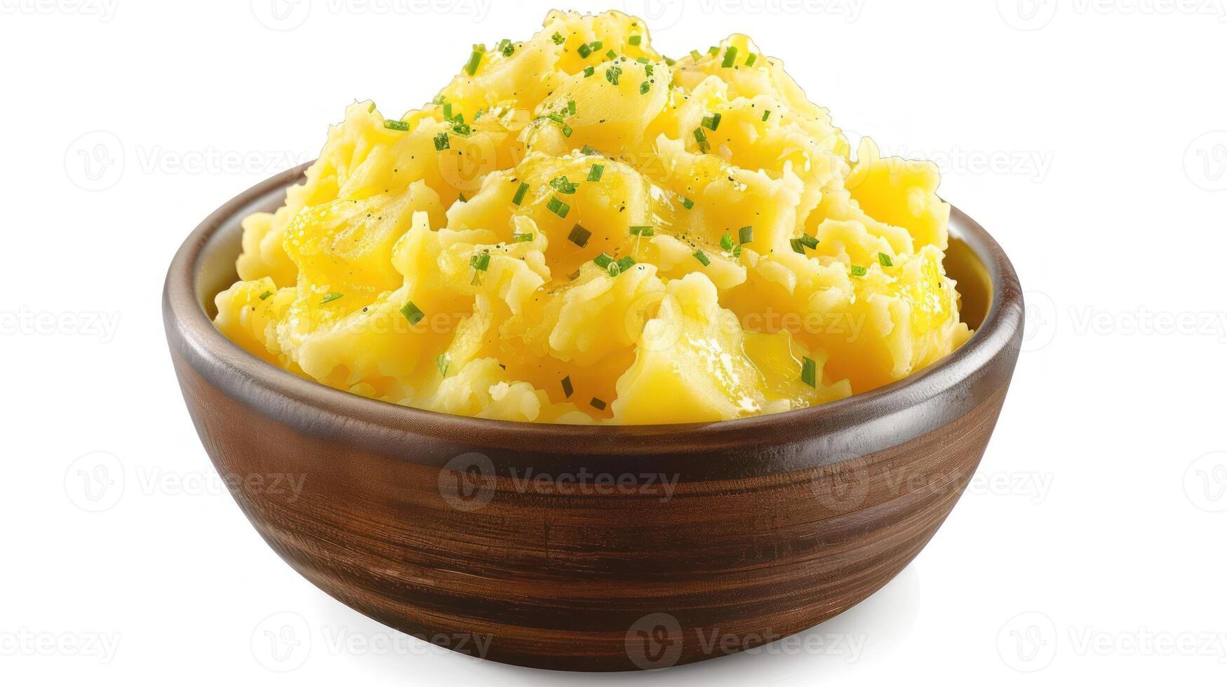 A bowl of creamy mashed potatoes garnished with chives, perfect for a hearty meal. photo