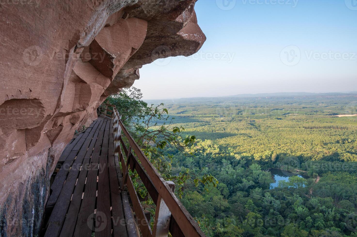 An iconic wooden stairs on Wat Phu Tok temple a quiet mountain and a place of peace and respect in Bueng Kan province of Thailand. photo