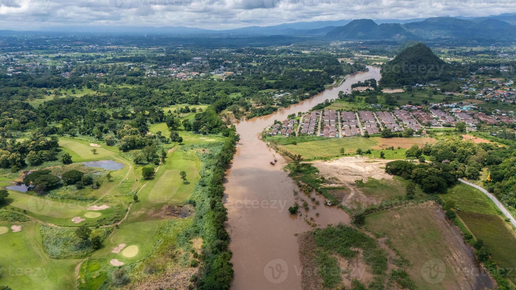 Aerial view of Mae Kok river flowing through Chiang Rai province of Thailand. This river is the blood line for people of Chiang Rai, started from the hills on boarder of Myanmar. photo