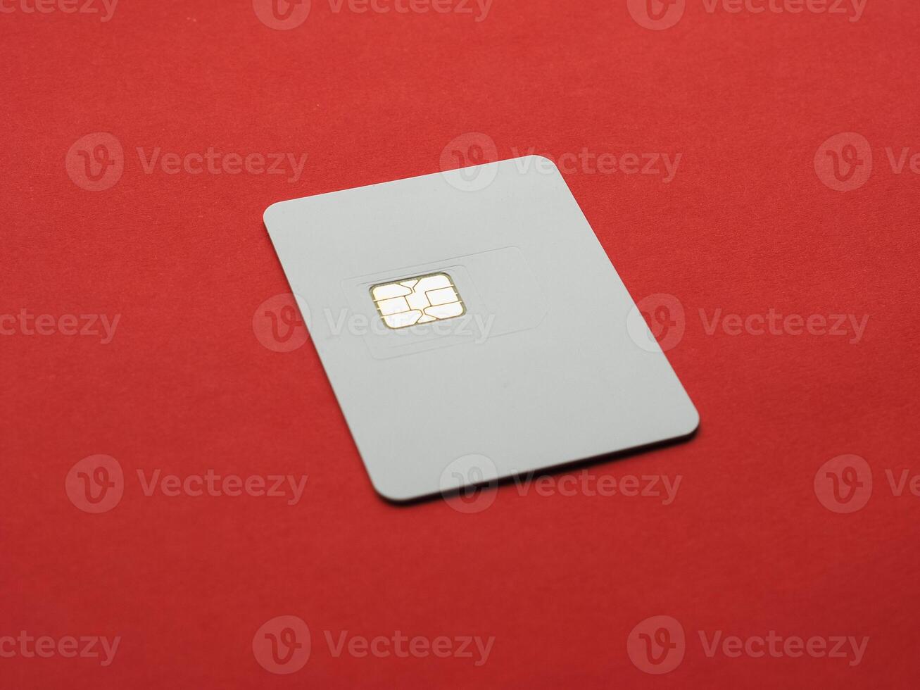 blank triple sim card over red photo