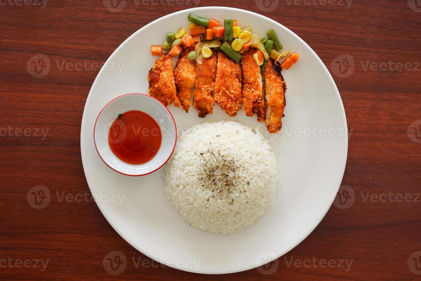 A plate of food with rice and vegetables photo