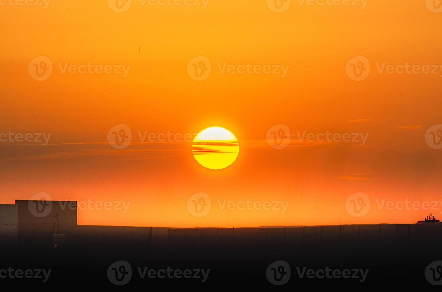 Breathtaking Sunset Over the Horizon Golden Hour Glow photo