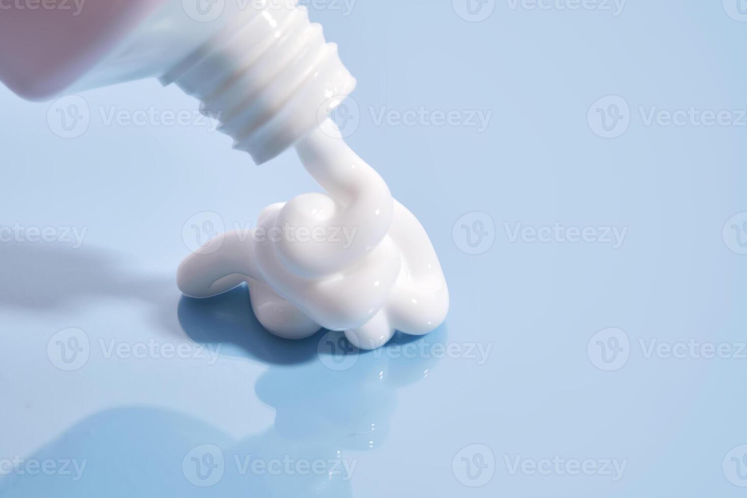The texture of white cream on a blue background. photo