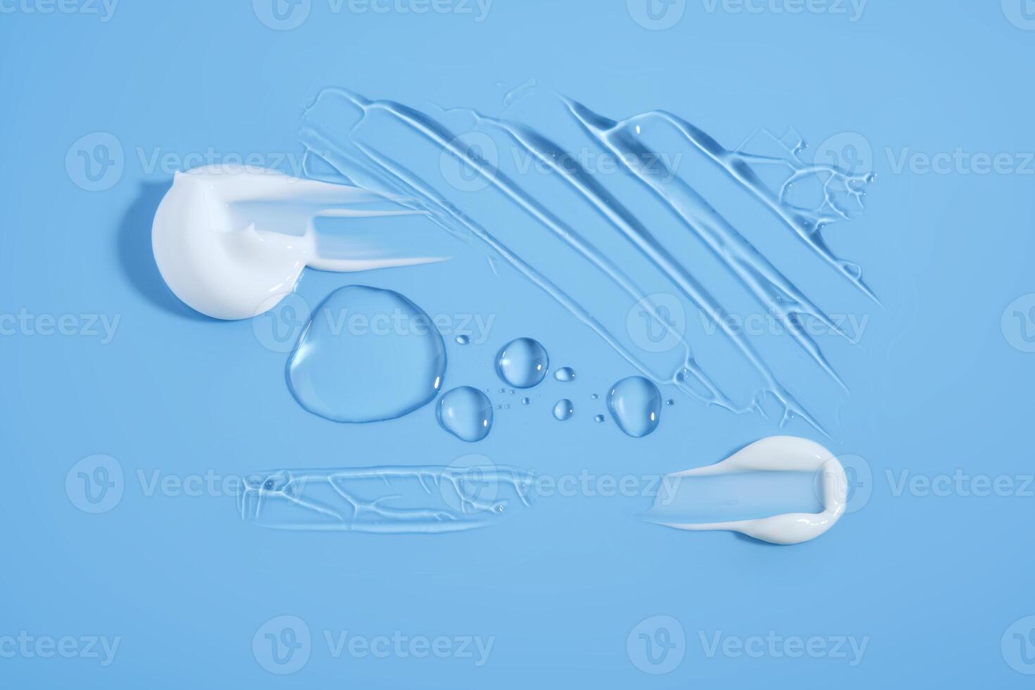 Drops and smears of cosmetic products on a blue background. photo