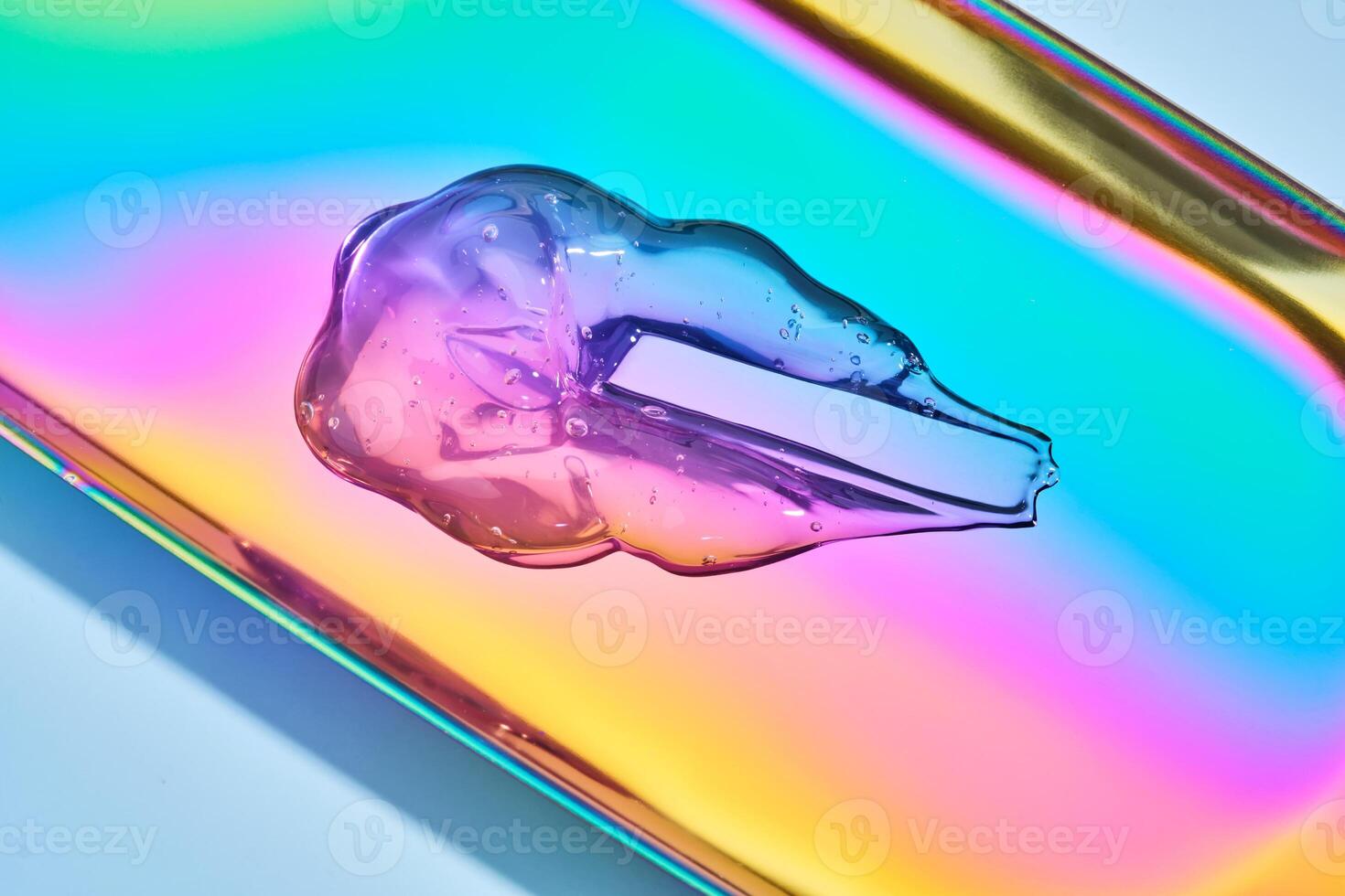 The texture of the cosmetic gel on a multicolored background. photo