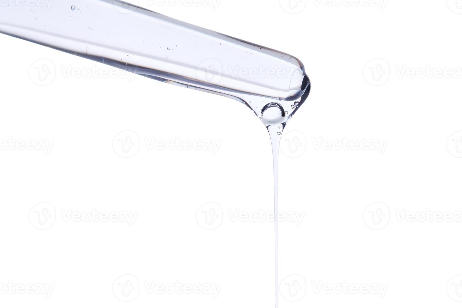 Pipette with delicate blue serum close-up. photo