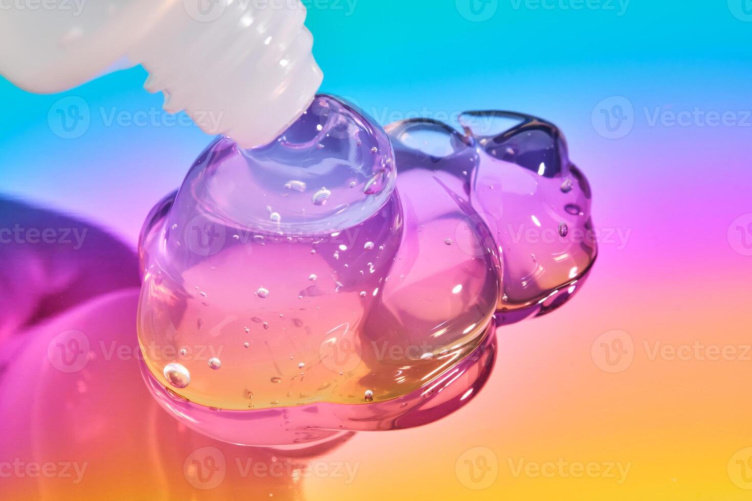 The texture of the cosmetic gel on a multicolored background. photo