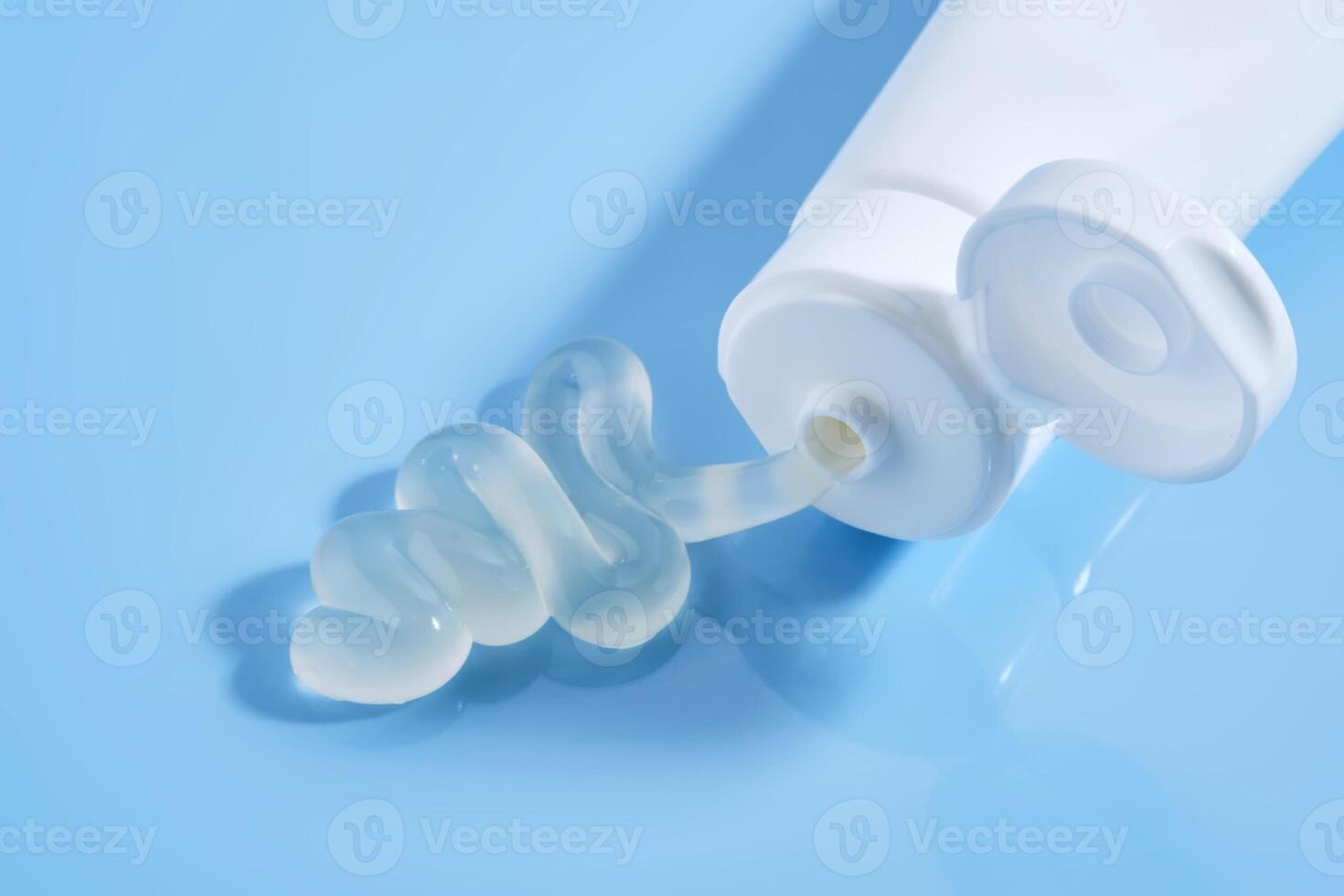 Gel toothpaste in a tube on a blue background. photo